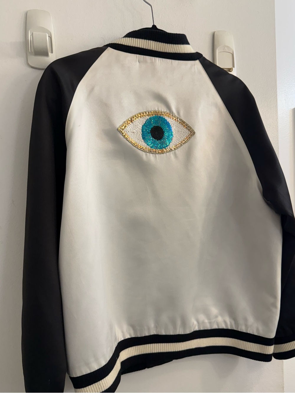 JOCELYN White and Black Satin Bomber Jacket with EVIL EYE EMBELLISHMENT